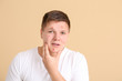 © Pixel-Shot - Teenage boy with acne on color background