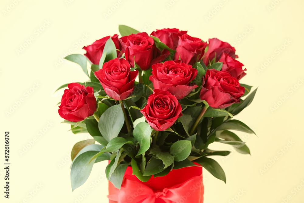 Bouquet of beautiful flowers on color background