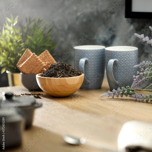 Photographie Tea on a wooden table in a sunny afternoon room