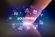© ra2 studio - Finger touching tablet with drawn social media icons and FOLLOWERS inscription, social networking concept