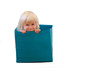 little cute girl inside a box isolated on a white background