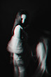 abstract Ghost girl on dark background with blurred