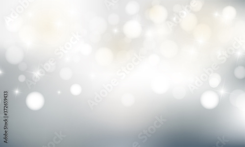 Fotografía Christmas background with blur golden lights with snowflakes.