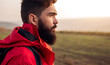 © kegfire - Serious bearded traveler standing in field