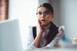 © zinkevych - Cute brunette girl in eyeglasses feeling schocked
