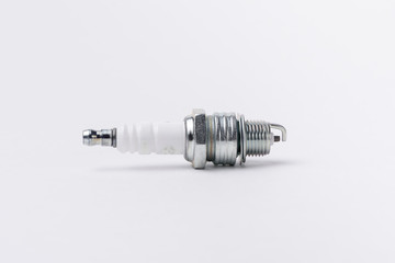 Car spark plugs on white background