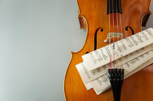Fragment Of Cello Or Violin With Bow And Notes On A Gray Background And Place For Text