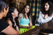 © TONL - Group of happy young women relaxing at bar