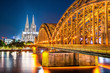 Cologne with the illuminated Cologne Cathedral, the Hohenzollern Bridge and the Rhine at night