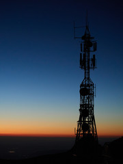 sunset with telecommunication tower in backlight