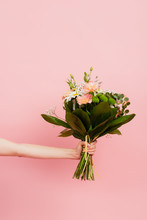 Cropped View Of Woman Holding Bouquet Of Flowers Isolated On Pink