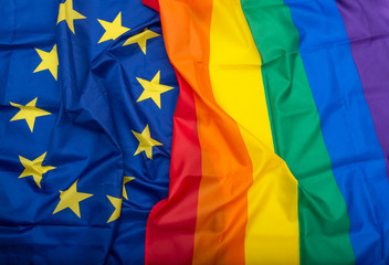 Fabric European Union EU and Rainbow flags, concept picture about human rights