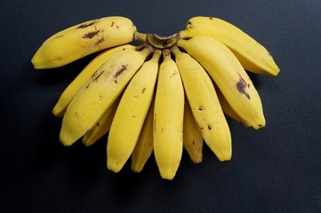 Bunch of Bananas on black background. Organic bananas. Fruits.
