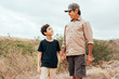 © kleberpicui - Latin grandfather and grandson in outdoor activities. Hiking hand in hand.