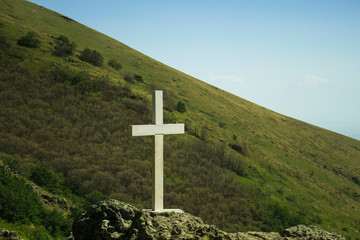 Wall Mural - White cross on the hill