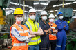 © godji10 - Portrait of confident engineer woman. Diverse multiethnic worker wearing surgical mask in manufacturing factory on day covid-19 virus pandemic. New normal, epidemic prevention. Selective focused