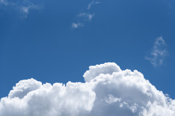 Cumulus cloud against a blue sky on a clear sunny day
