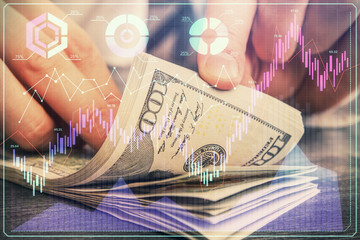 Multi exposure of forex graph drawing hologram and USA dollars bills and man hands. Technical Analysis concept.