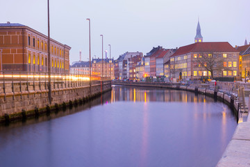 the hop on hop off boat for tourist in the river near christiansborg palace in copenhagen, denmark