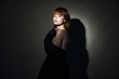 © SHOTPRIME STUDIO - Disco relaxed woman cloak dark room cropped view