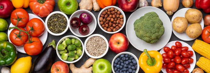  Healthy eating ingredients: fresh vegetables, fruits and superfood. Nutrition, diet, vegan food concept