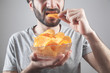 © andranik123 - Caucasian man eating tasty potato chips.