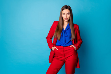 Wall Mural - Portrait of her she nice-looking attractive lovely pretty gorgeous fashionable content lady posing holding hands in pockets isolated over bright vivid shine vibrant blue color background