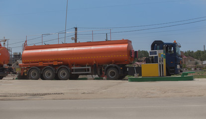 Poster - Fuel trucks unload fuel