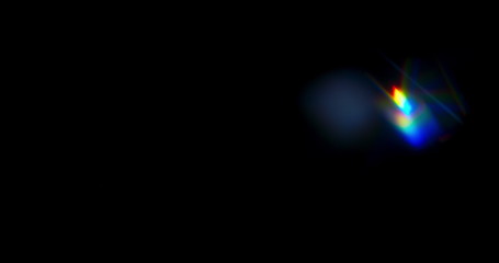 blue light flare prism rainbow light flares overlay on black background
