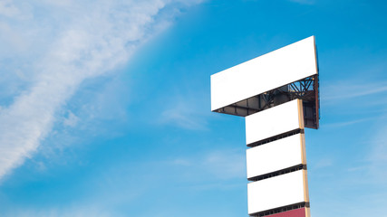 Wall Mural - mock up image: four blank white billboards or large displays on tower and clouds against blue sky. m