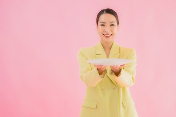 Poster - Portrait beautiful young asian business woman with dish or plate