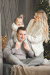 © olenachukhil - Adorable loving family on christmas background
