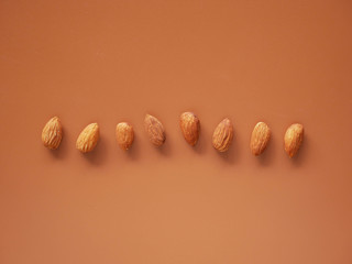 Wall Mural - Almonds isolated on background, nut beans