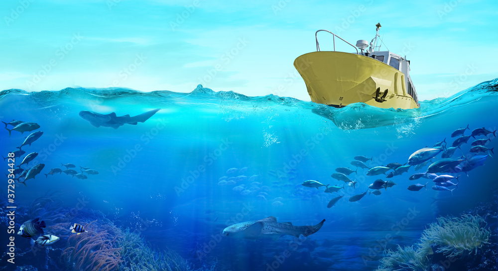 Fishing boat in the sea. Large school of fish in the ocean. Underwater world with sea animals. - obrazy, fototapety, plakaty 