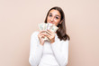 © luismolinero - Young woman over isolated background taking a lot of money