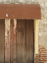 Poster - Wooden door of a stone house