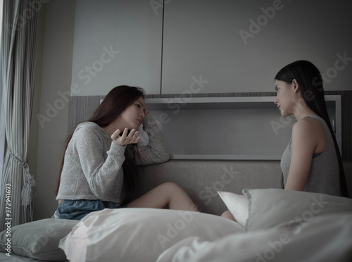 Two beautiful ladies talking together with unhappy feeling,bad relationship