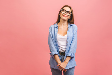 Wall Mural - Image of happy young business woman posing isolated over pink wall background.