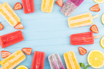 Poster - Healthy Whole Fruit Popsicles with Berries Strawberry orange  Dragon fruit  on wooden vintage table