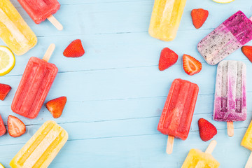 Poster - Healthy Whole Fruit Popsicles with Berries Strawberry orange  Dragon fruit  on wooden vintage table