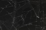 Black cracked glass texture background. Crack on the glass. Broken screen. Broken dark phone.  White cracks in glass