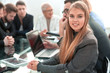 © ASDF - Smiling bank manager greets a warm personality with a bright wide smile in the office