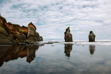 Sticker - Breathtaking shot of two rocks in the middle of the sea on Cathedral Cove, New Zealand