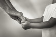 © kieferpix - Mother holding Childs hand showing him love and support