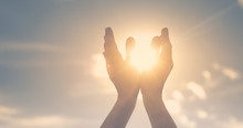 Hands In The Sky Holding The Sun. Spiritual Healing Concept. 