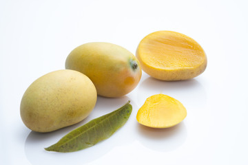 Sticker - Closeup shot of fresh mango fruits on an isolated background