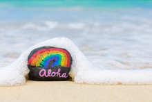 Aloha Word On Hawaii Beach Sand. Hawaiian Rainbow.