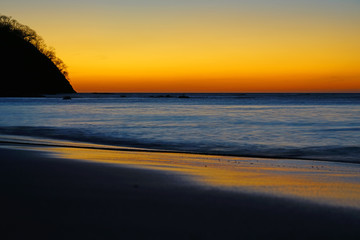 Wall Mural - Dramatic orange sunset over the Playa Virador beach in Peninsula Papagayo in Guanacaste, Costa Rica