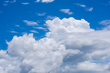 Sunny clear blue sky background with beautiful puffy fluffy clouds & soft white cloudscape in tropical summer or spring morning sunlight & sun rays on bright daylight horizon at sunshine day,blue sky