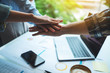 © Farknot Architect - Closeup image of business team standing and joining their hands together in office